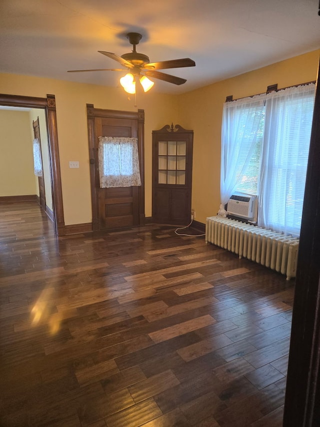 616 N Pleasant St, Princeton, IL 61356 - entrance foyer featuring plenty of natural light, a ceiling fan, dark wood finished floors, and cooling unit