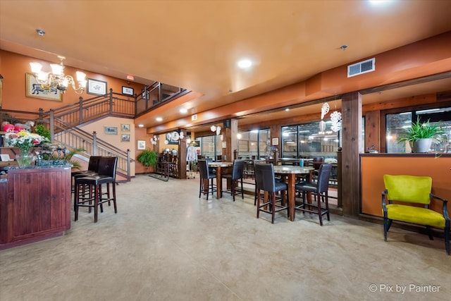 dining space featuring a notable chandelier