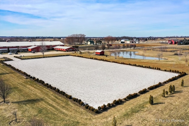 bird's eye view with a water view and a rural view