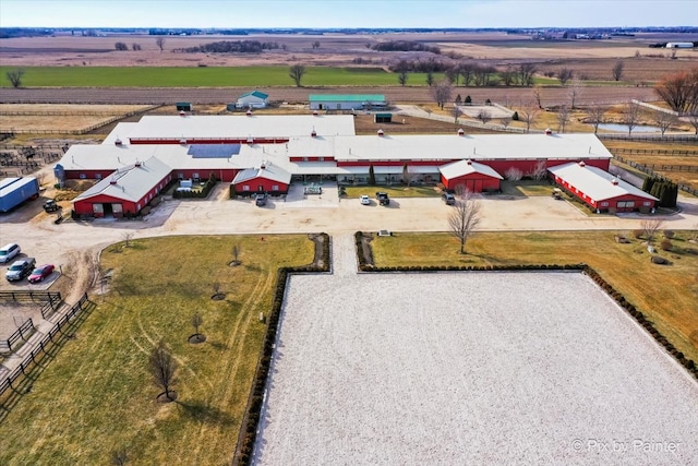 birds eye view of property with a rural view