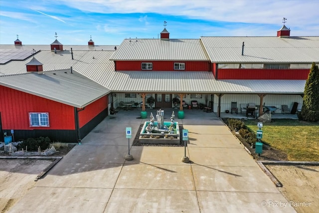 back of house with a yard and a patio area