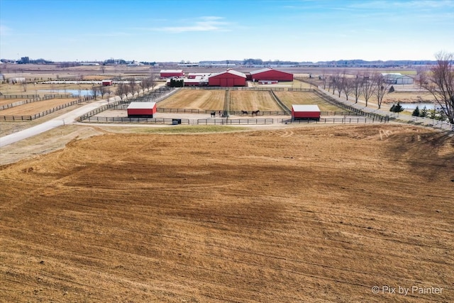 birds eye view of property featuring a rural view