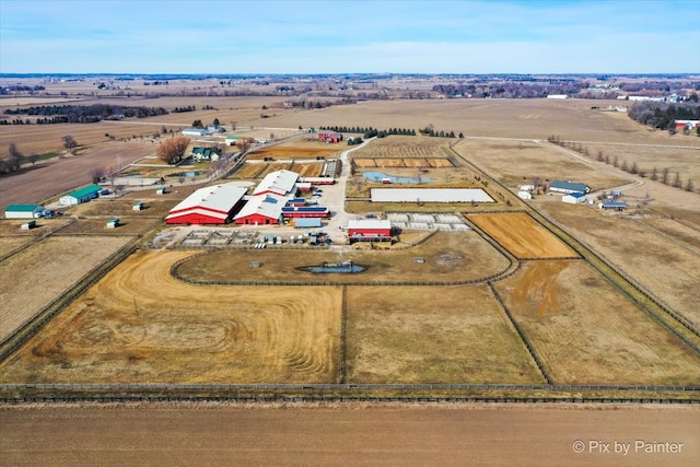 birds eye view of property with a rural view