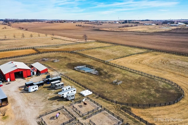 birds eye view of property with a rural view