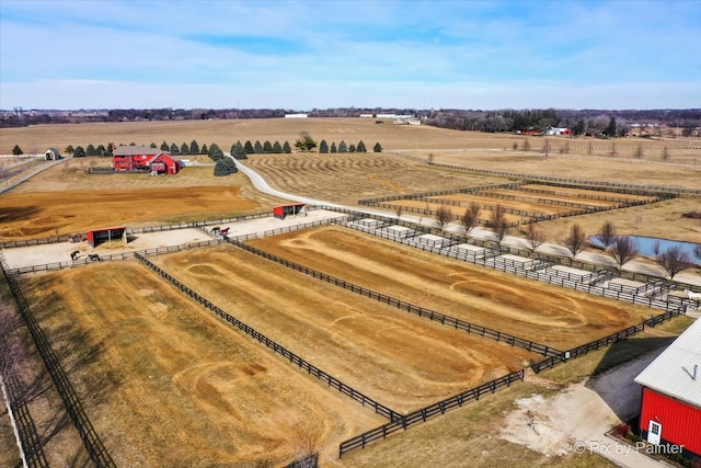 birds eye view of property featuring a rural view