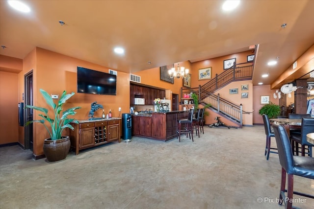 living room featuring an inviting chandelier