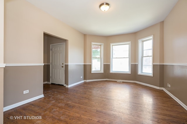 spare room featuring dark hardwood / wood-style floors