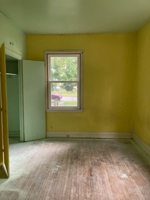 unfurnished bedroom with light wood-type flooring