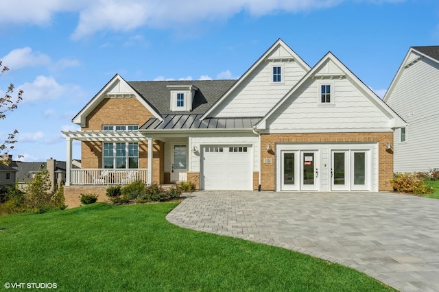 view of front of home with a standing seam roof, a front yard, a pergola, and brick siding