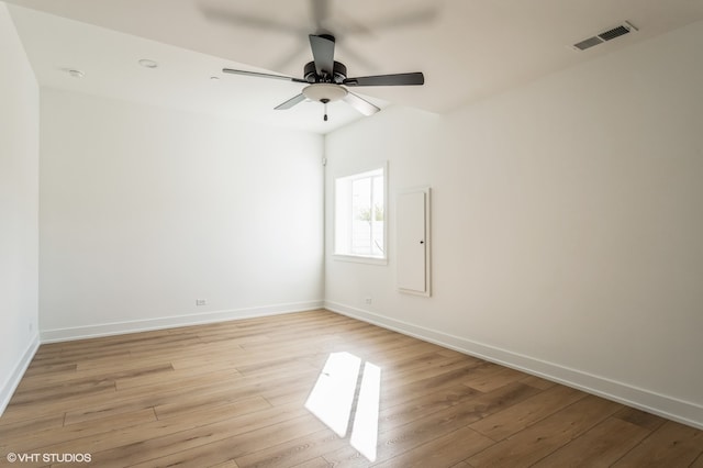 unfurnished room with ceiling fan and light wood-type flooring