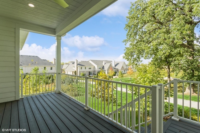 wooden deck featuring a residential view