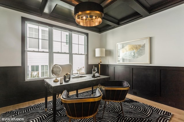 office featuring a chandelier, coffered ceiling, and wood finished floors