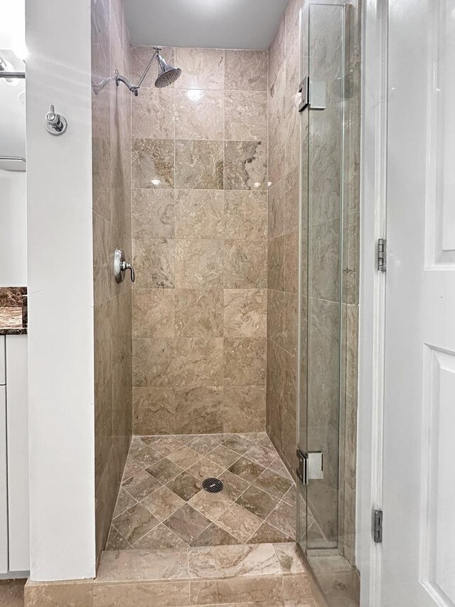 bathroom featuring an enclosed shower