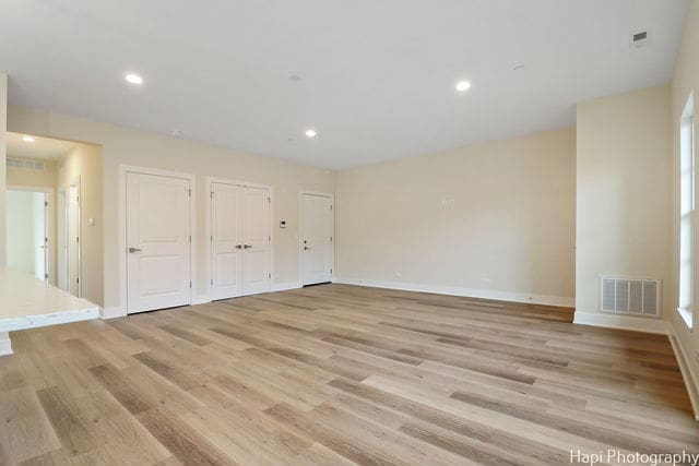 spare room featuring light wood-type flooring