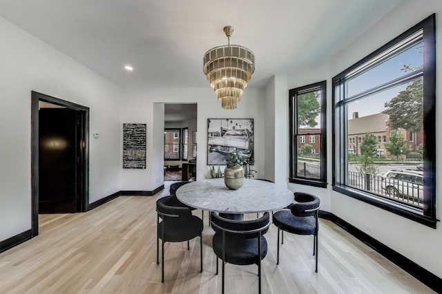 2457 N Talman Ave, Chicago, IL 60647 - dining space featuring light wood-style floors, a chandelier, baseboards, and recessed lighting