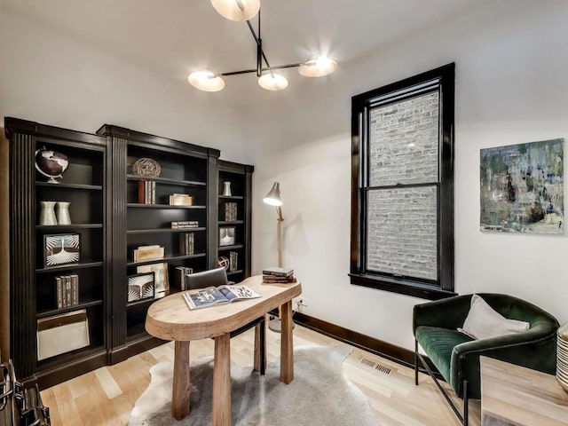 2457 N Talman Ave, Chicago, IL 60647 - office featuring a chandelier and light wood-style floors