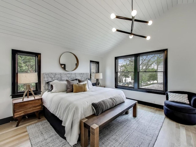 2457 N Talman Ave, Chicago, IL 60647 - bedroom featuring lofted ceiling, multiple windows, light wood finished floors, wood ceiling, and baseboards