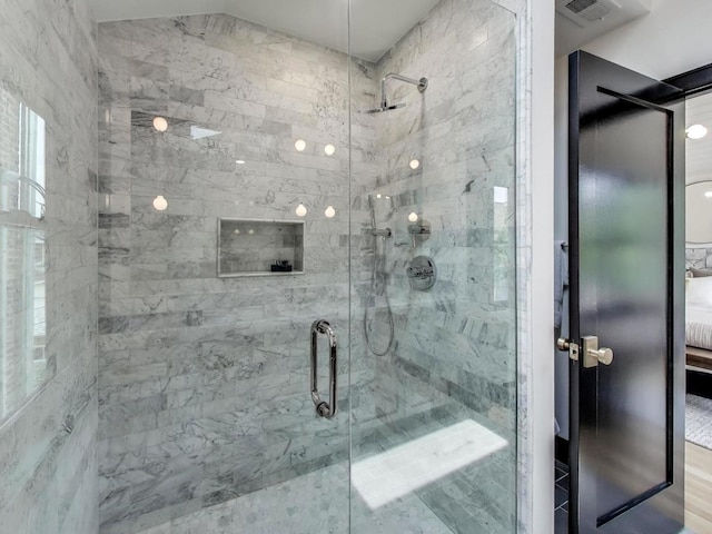 2457 N Talman Ave, Chicago, IL 60647 - bathroom with a stall shower, ensuite bath, and wood finished floors