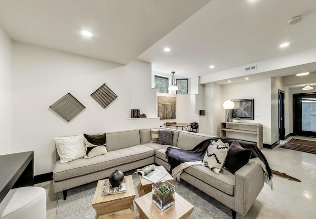 2457 N Talman Ave, Chicago, IL 60647 - living room featuring recessed lighting, baseboards, and finished concrete floors