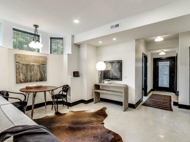 2457 N Talman Ave, Chicago, IL 60647 - living room with recessed lighting, finished concrete flooring, and baseboards