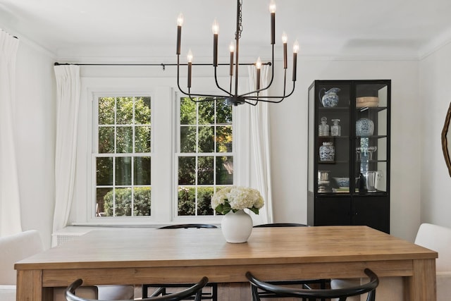 298 Dickens St, Northfield, IL 60093 - dining room featuring a chandelier and ornamental molding