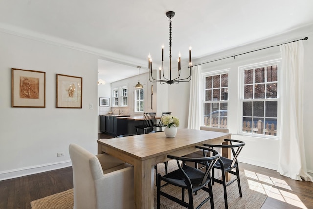 298 Dickens St, Northfield, IL 60093 - dining area with a chandelier, dark wood finished floors, and baseboards