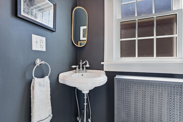 298 Dickens St, Northfield, IL 60093 - bathroom featuring radiator heating unit and healthy amount of natural light