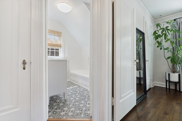 298 Dickens St, Northfield, IL 60093 - bathroom with vaulted ceiling, a tub to relax in, baseboards, and wood finished floors