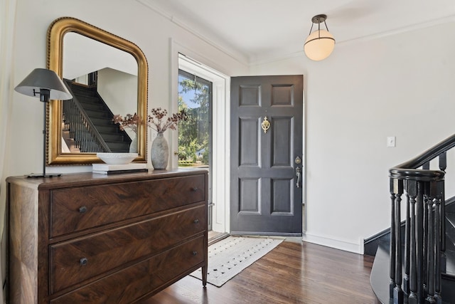 298 Dickens St, Northfield, IL 60093 - foyer with stairs, wood finished floors, baseboards, and crown molding