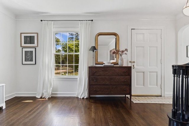 298 Dickens St, Northfield, IL 60093 - bedroom featuring wood finished floors, baseboards, and arched walkways