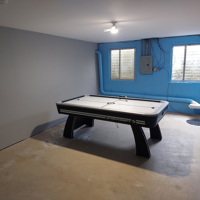 rec room featuring ceiling fan and concrete flooring