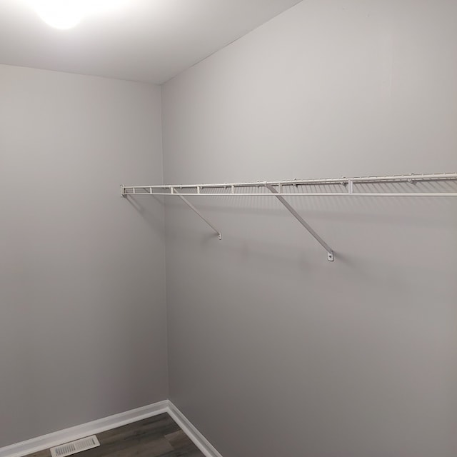 spacious closet with hardwood / wood-style floors