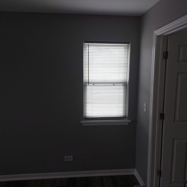 spare room with hardwood / wood-style floors