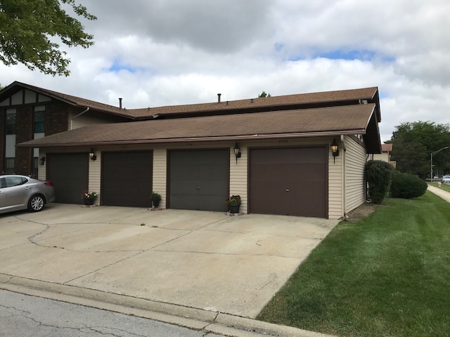 exterior space featuring a front yard and a garage