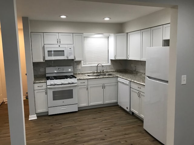 kitchen featuring sink, white appliances, dark hardwood / wood-style floors, and white cabinets