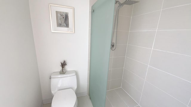 full bathroom with toilet and a shower stall