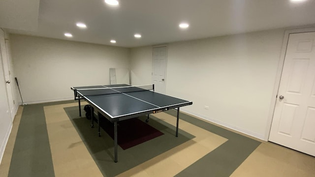 recreation room with recessed lighting, baseboards, and concrete floors