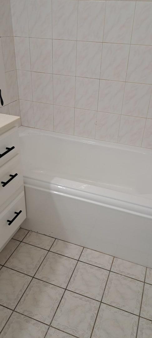 bathroom with vanity and tile flooring