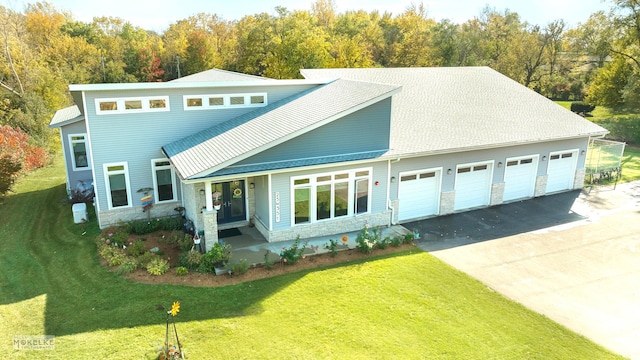 view of front property featuring a front yard and a garage