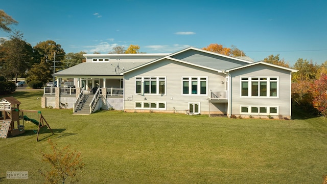 rear view of house with a lawn