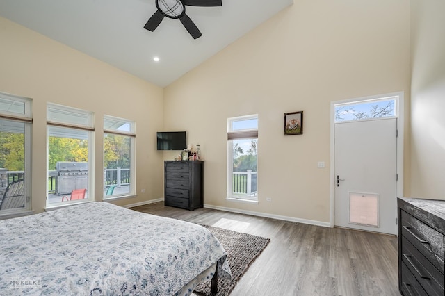 bedroom featuring ceiling fan, high vaulted ceiling, access to outside, and light wood-type flooring