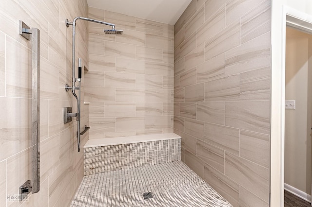 bathroom featuring tiled shower