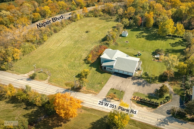 birds eye view of property with a rural view