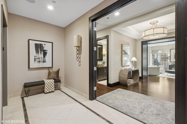 hall with light hardwood / wood-style floors