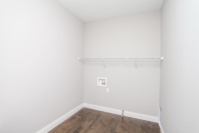 laundry room featuring washer hookup and dark hardwood / wood-style flooring