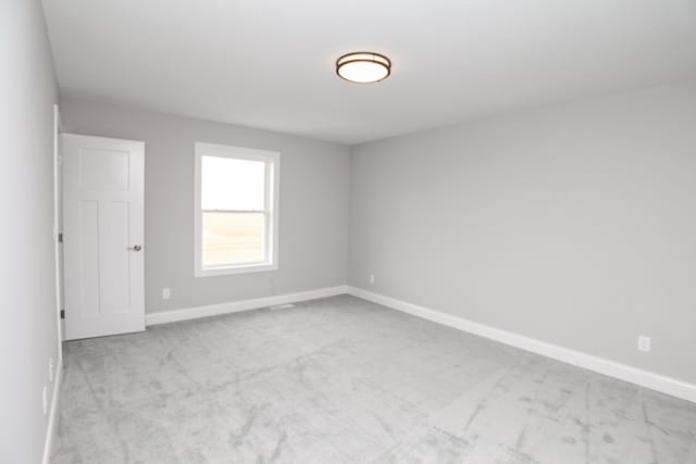 view of carpeted spare room