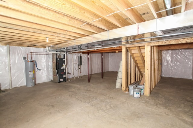 basement featuring water heater and heating unit