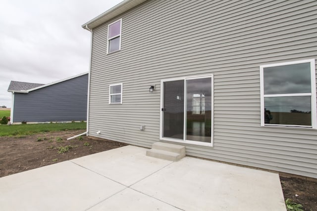 rear view of property featuring a patio area