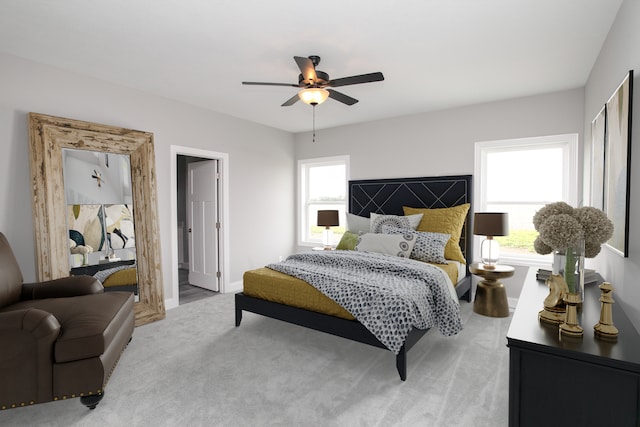 carpeted bedroom featuring multiple windows and ceiling fan