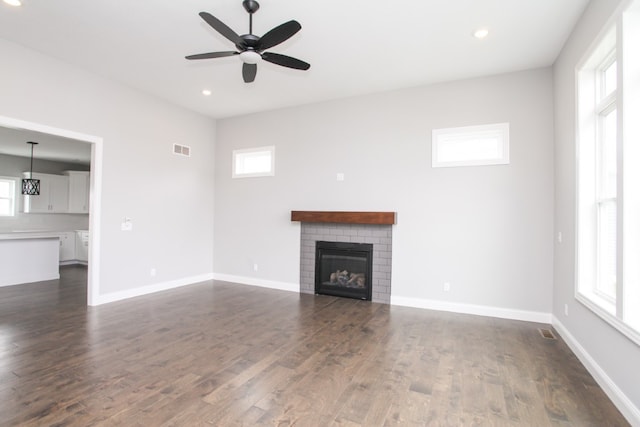 unfurnished living room featuring ceiling fan and wood-type flooring